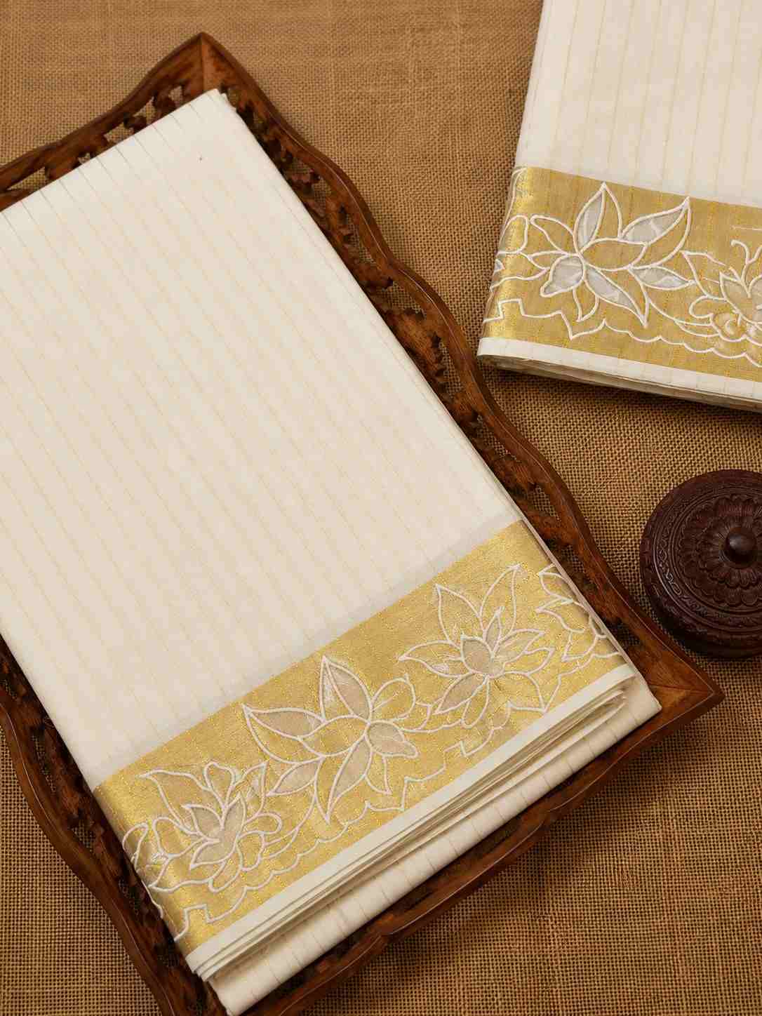Kerala Kasavu Saree with a beautiful floral golden border